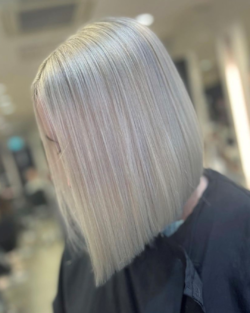 An ash blonde long straight bob by Rush.