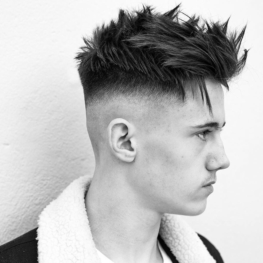 Cool choppy textured quiff haircut and bald fade