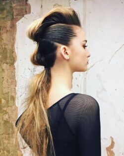 Hair styled into a pinned updo ponytail for Christmas by Rush.
