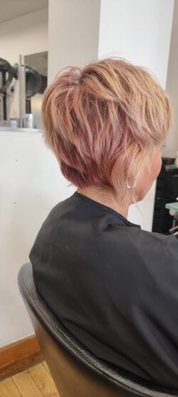 A colour mismatched blonde pixie cut.