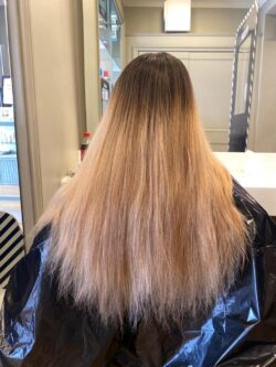 A dry blonde balayage with faded colour.